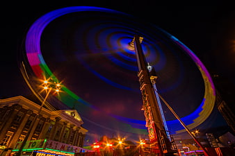 Long Exposure of Spinning Carnival Ride at Night