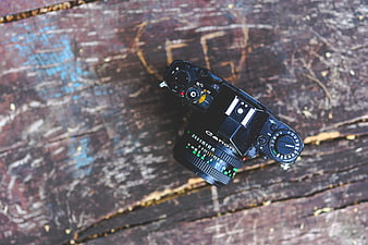 Vintage Canon Film Camera on Weathered Wood