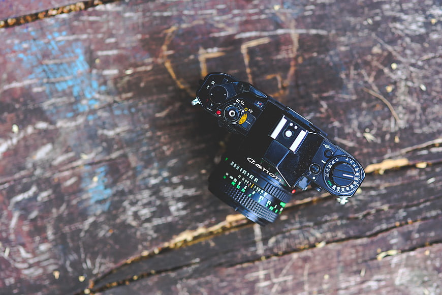 Vintage Canon Film Camera on Weathered Wood