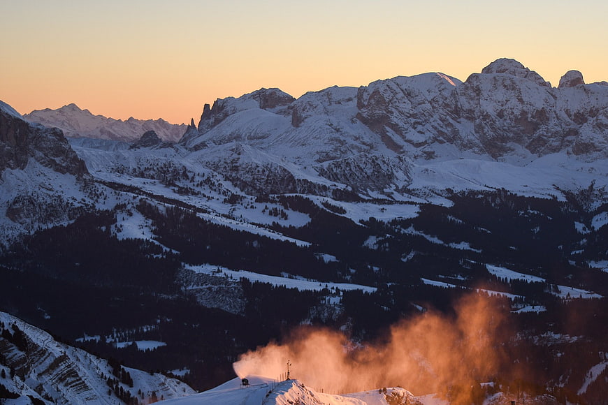 Snowy Mountain Landscape with Snow Cannon at Sunset