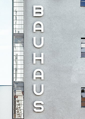 Vertical Bauhaus Sign on Modern Concrete Building Facade