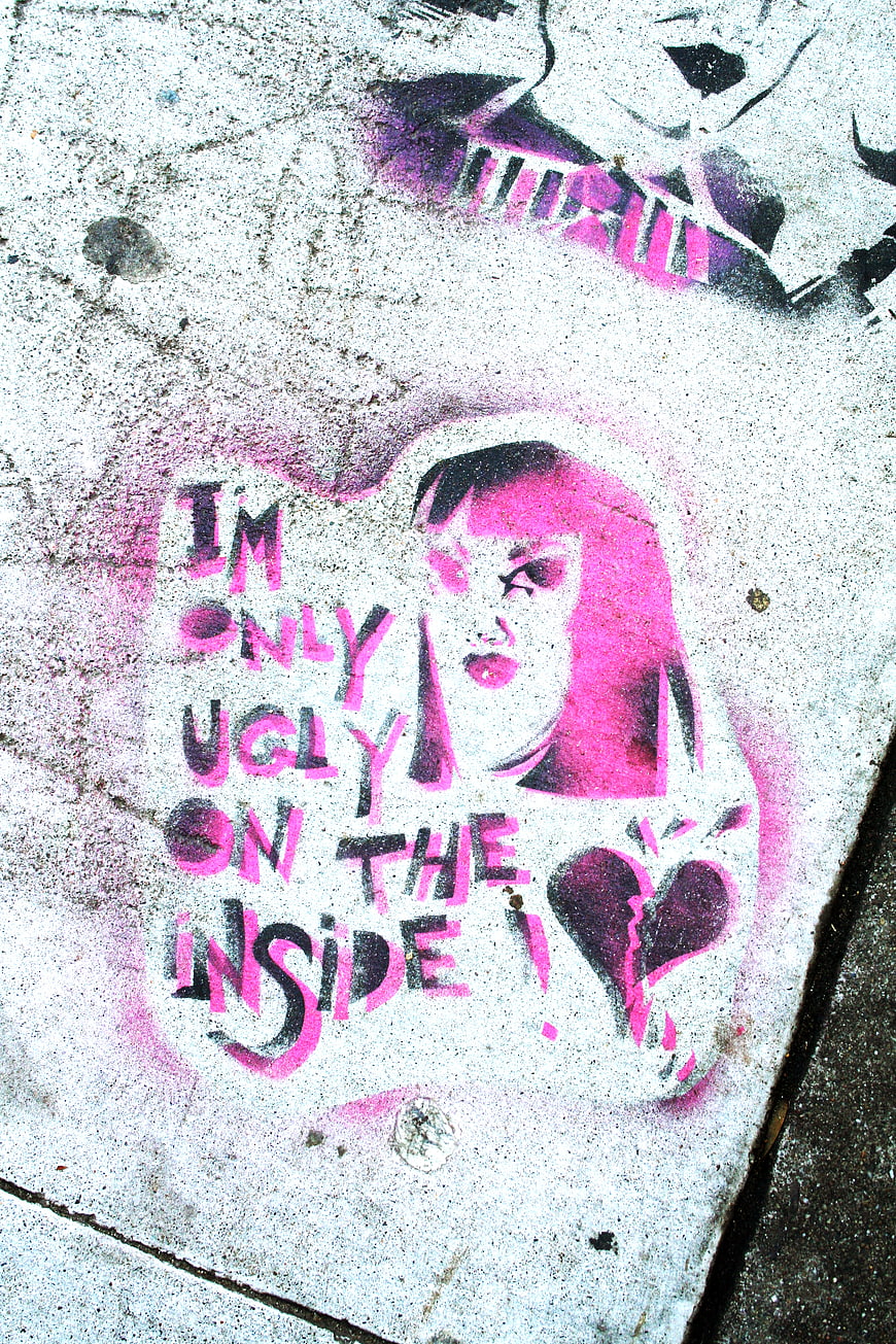 Pink Graffiti Art on Concrete Wall with Inspirational Quote
