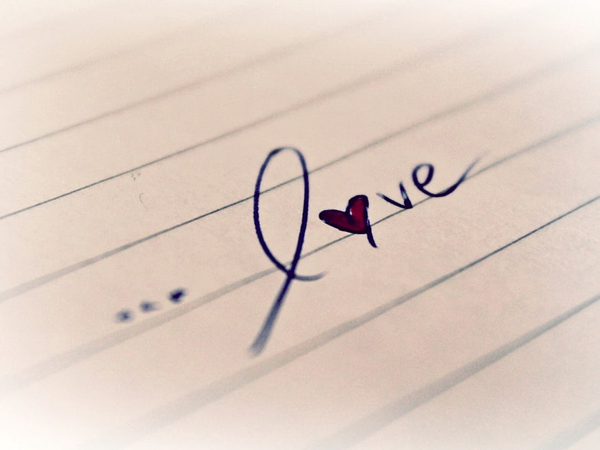 Handwritten Love Word with Heart on Lined Paper