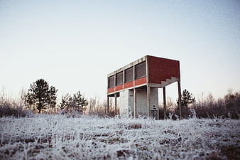 Frosty Field with Brutalist Concrete Structure