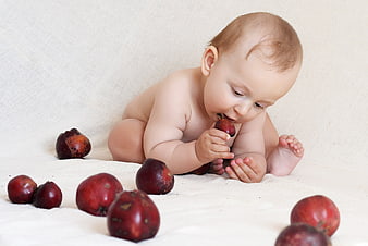 Baby Eating Apple On White Background