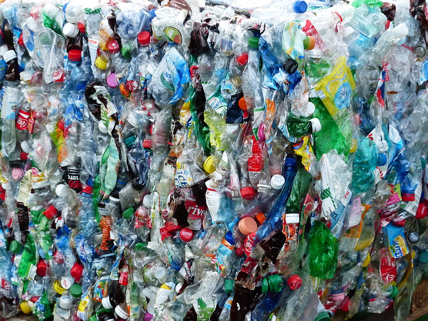 Compressed plastic bottles for recycling and waste management