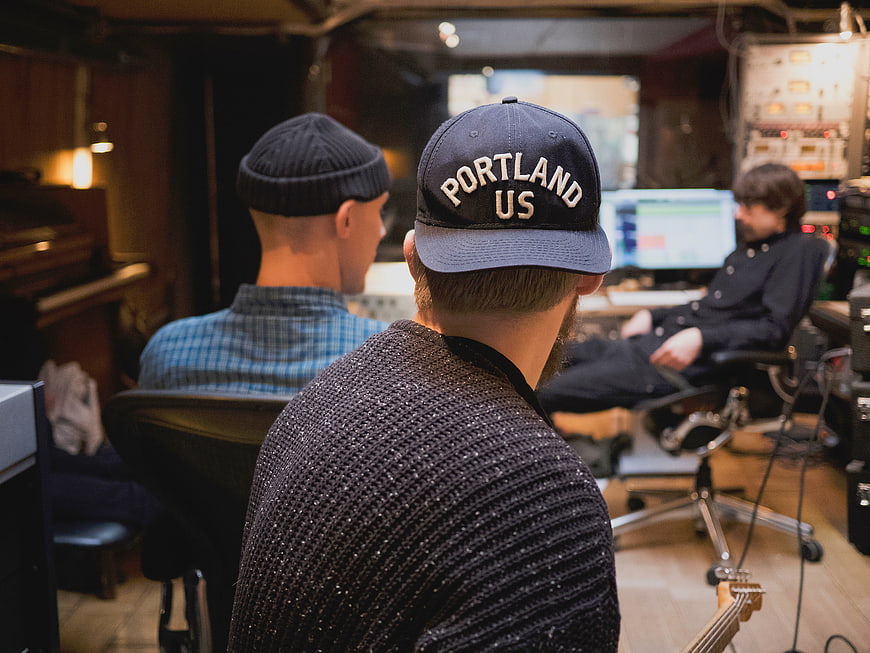 Music producers working in recording studio