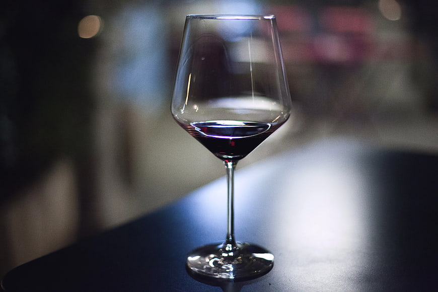 Glass of Red Wine on Dark Table