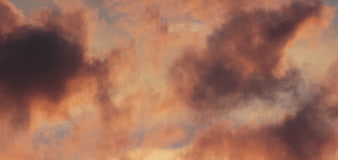 Dramatic orange and purple clouds at sunset