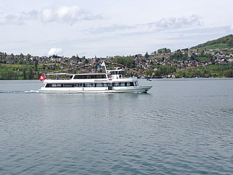 White passenger ferry boat sailing on Lake Hallwil, Switzerland