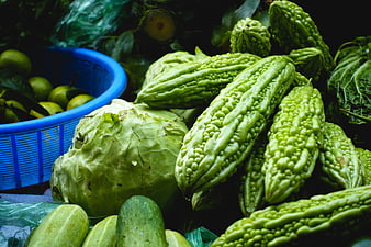 Fresh bitter melon and vegetables at Asian market