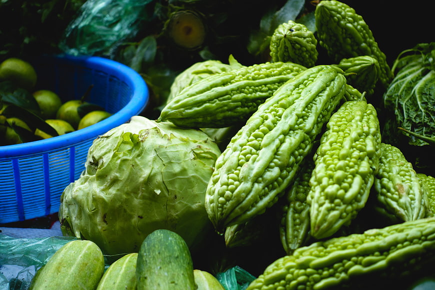 Fresh bitter melon and vegetables at Asian market