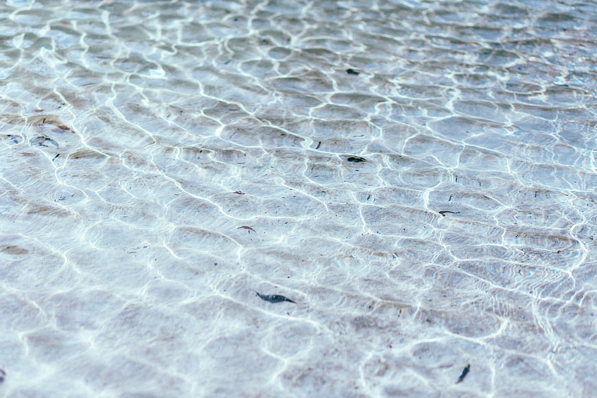Crystal Clear Shallow Ocean Water Ripples on Sandy Beach