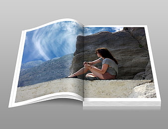 Open Photobook Mockup Featuring Woman Sitting On Rocky Cliff