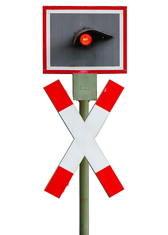 Railroad crossing signal with red light and crossbuck sign