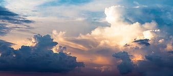Dramatic Sunset Sky with Golden Sunbeams Through Clouds