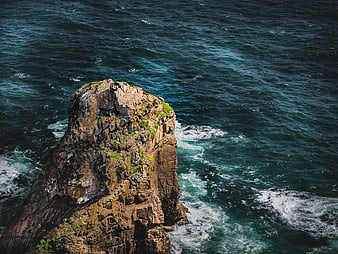 Aerial View of Rocky Sea Stack in Turquoise Ocean