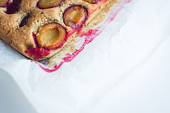Close-up of traditional Czech plum cake on parchment paper