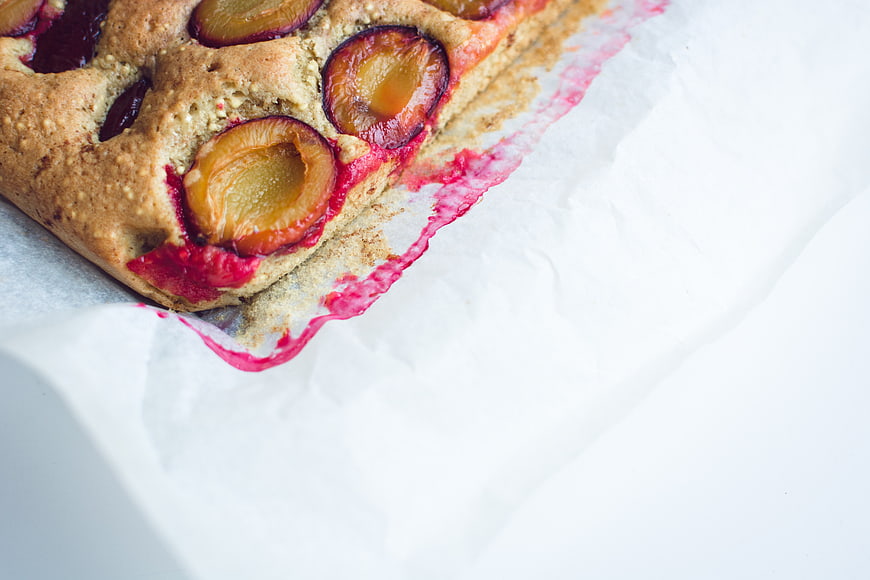 Close-up of traditional Czech plum cake on parchment paper
