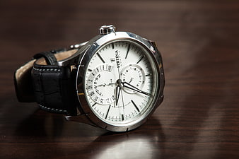 Fossil Chronograph Watch on Dark Wood Surface