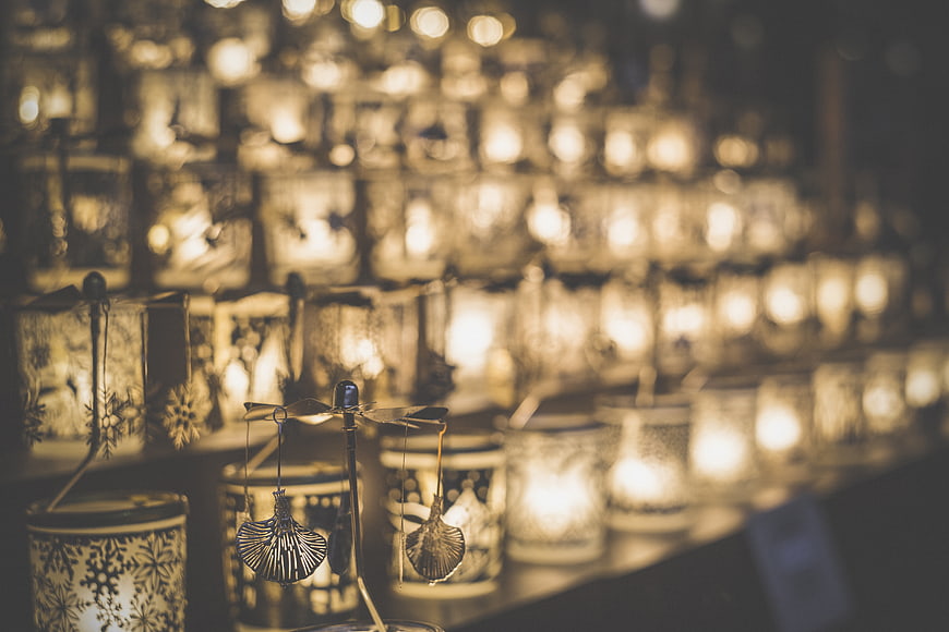 Rows of glowing decorative lanterns with dragonfly ornament