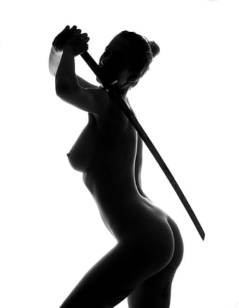 Black and white silhouette of a nude woman holding a sword