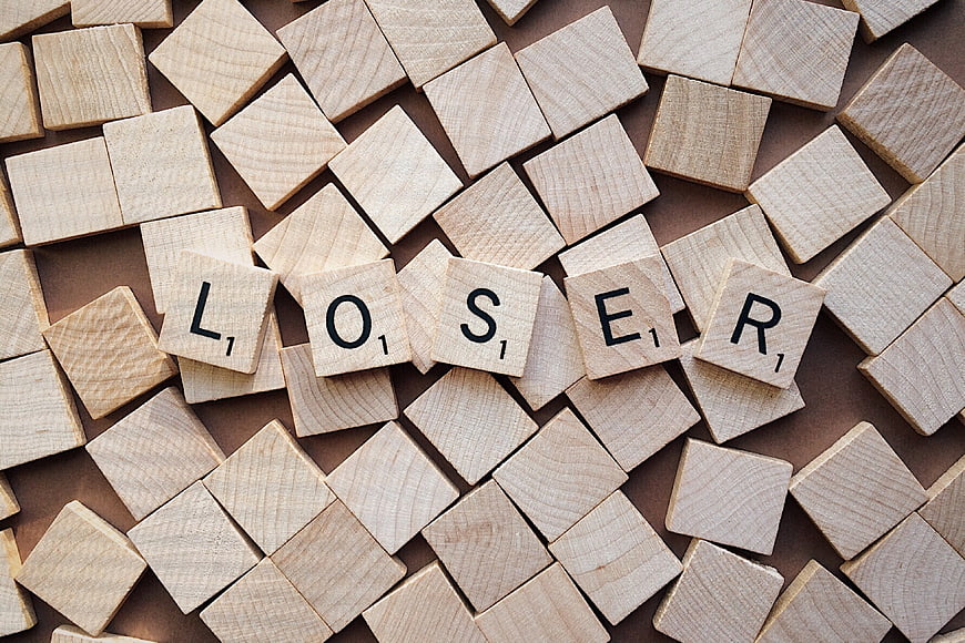 Wooden Scrabble Tiles Spelling Loser On Brown Background