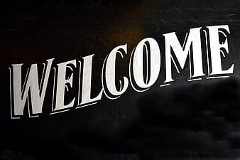 White Welcome Text on Dark Textured Background