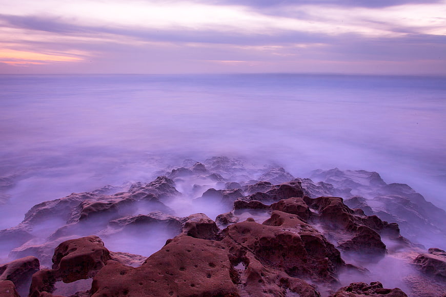 Long Exposure Misty Rocky Coastline at Dusk