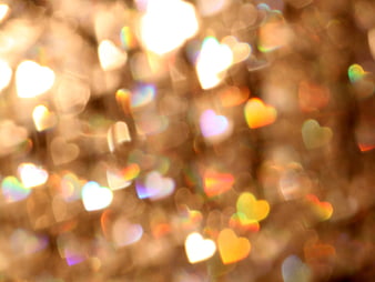 Abstract Heart-Shaped Bokeh Background with Warm Golden Lights