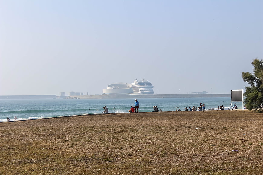 Cruise ship and Opera House in Porto from sandy beach