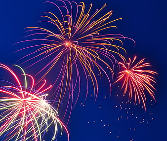 Vibrant Fireworks Display Against Deep Blue Night Sky