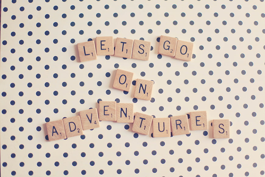 Scrabble Tiles Spelling Lets Go On Adventures On Polka Dot Background