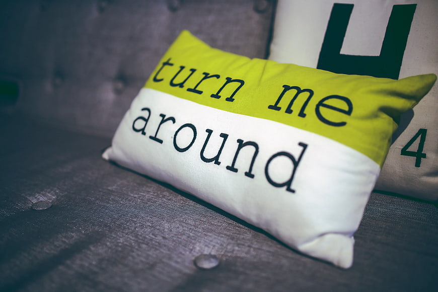 Lime green and white decorative pillow with text