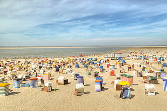 Colorful Beach Huts on Sandy Shore with Ocean View