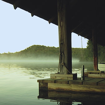 Misty Morning Lake View from Wooden Dock with Flashlight