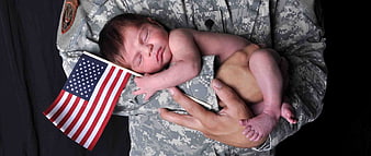 Newborn Baby Sleeping In Military Uniform With American Flag