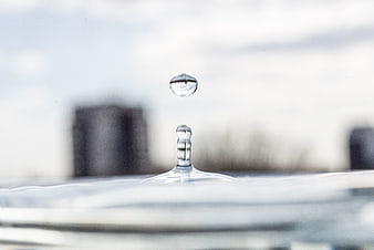 High-speed water droplet splash on reflective surface