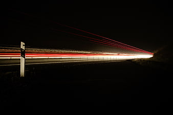 Highway Light Trails at Night with Red and White Streaks