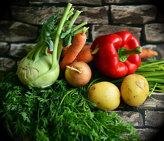 Fresh Harvest Vegetables Including Carrots, Potatoes, and Red Bell Pepper