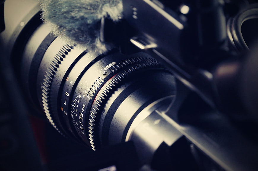 Close-up of vintage camera lens with focus rings