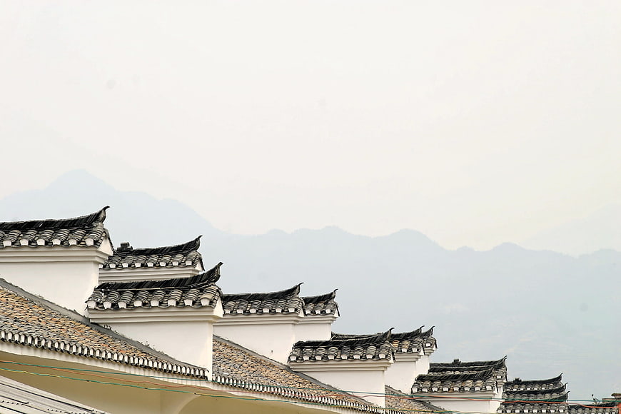 Traditional Chinese Hui-style Architecture with White Walls and Black Tile Roofs