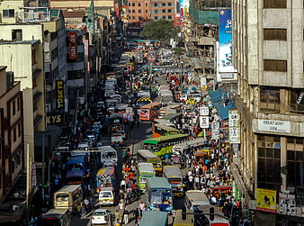 Busy Nairobi street traffic with matatus and pedestrians