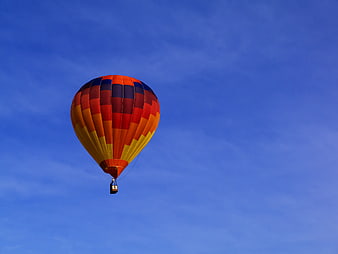 Colorful Hot Air Balloon Flying in Blue Sky