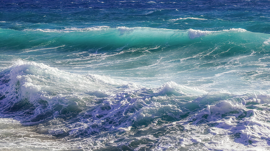 Dynamic Ocean Waves With Turquoise Water And White Sea Foam