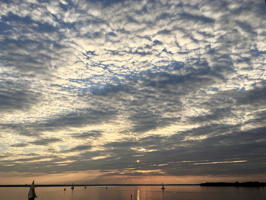 Dramatic Mackerel Sky Clouds Over Sunset Sailboats