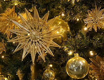 Gold Straw Stars and Ornaments on Christmas Tree