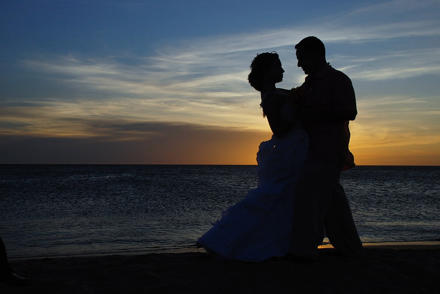 Silhouette of Wedding Couple Dancing on Beach at Sunset