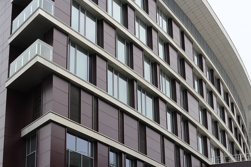 Modern curved apartment building facade with balconies