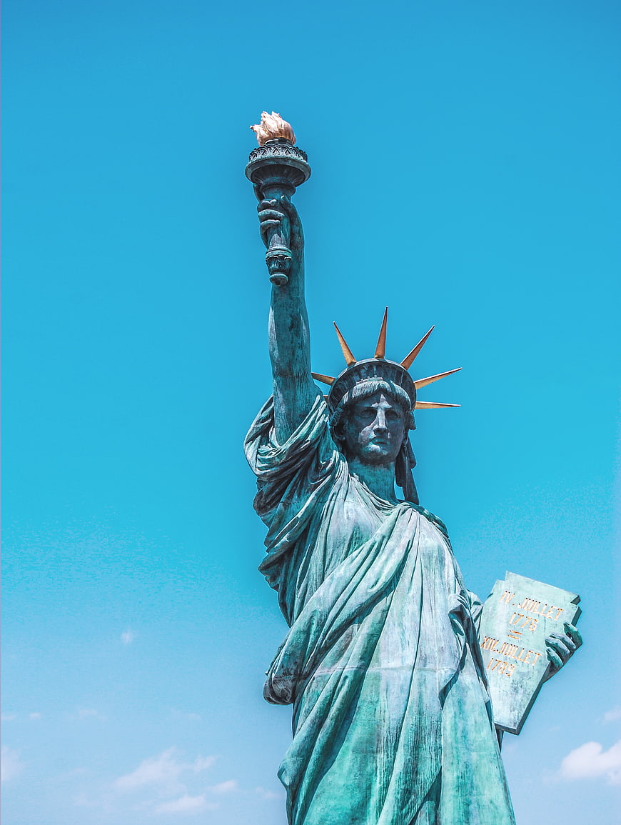 Statue of Liberty against bright blue sky